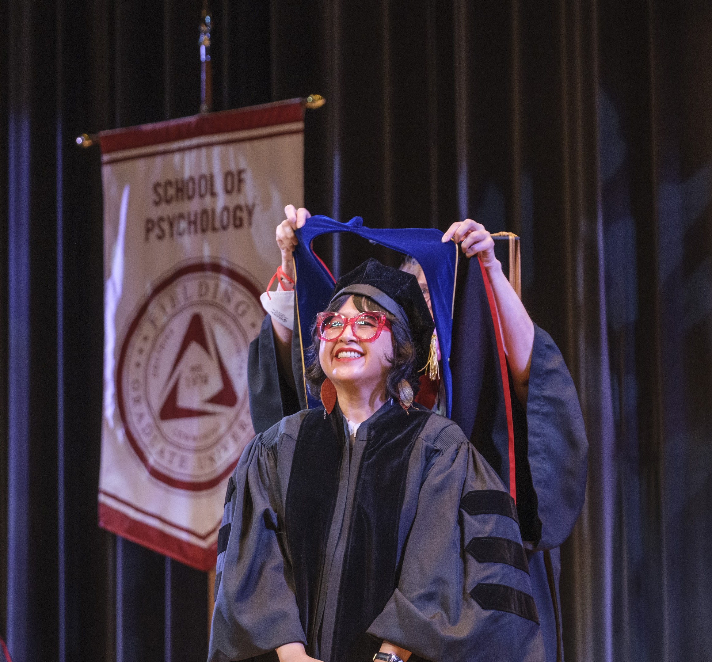 Graduate being Hooded at Global Session July 2024